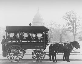 Photo of horse-drawn tour bus in front of Capitol Building.