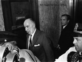 Image: John Mitchell, the chairman of President Nixon's reelection committee and former attorney general, enters the Senate Caucus Room to testify before the Watergate Committee.
