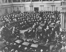 Photo of Winston Churchill speaking to legislators in crowded Senate Chamber.