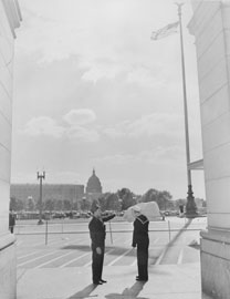 Photo of a sailor in uniform with his bag over his shoulder outside of Union Station.