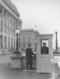 Photo of two policemen on guard in front of Capitol Building