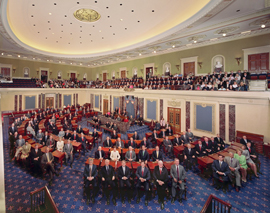 Photograph of all one hundred senators at their desks in the Senate Chamber.