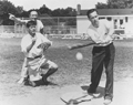 Photograph of three senators playing baseball.