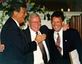 Image: Howard Baker (center) greets Senators Trent Lott (left) and Tom Daschle (right) at his address for the Leader's Lecture series, July 14, 1998.