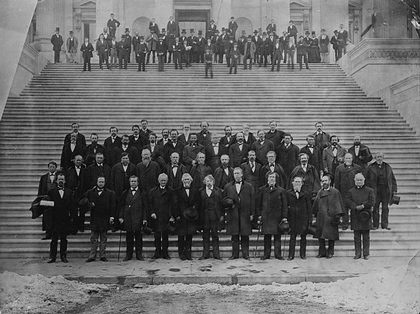 Photograph of senators standing on the Capitol steps.