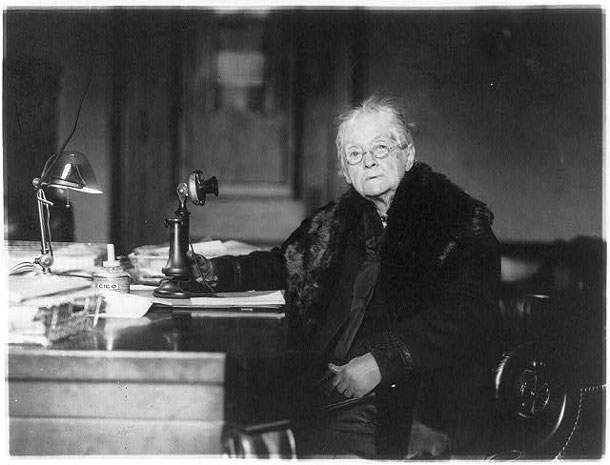 Rebecca Latimer Felton sitting at her desk in the Senate Office Building